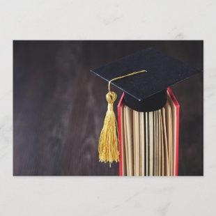 Cap and tassel on graduation invitation